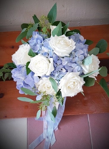blue hydrangea and white rose bouquet