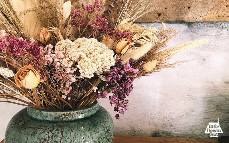 A vase of dried flowers