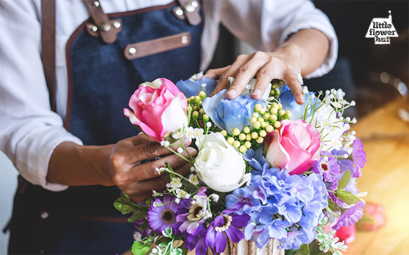 Florist arranging flowers in a vase