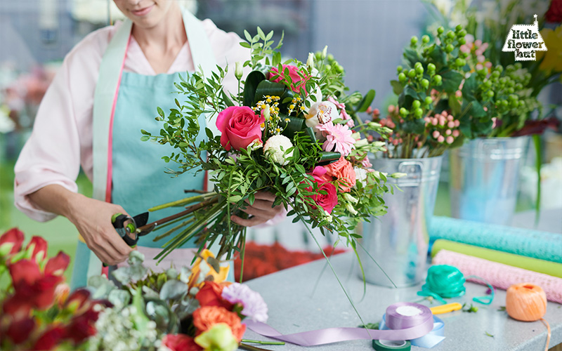 Florist cutting the flower stems