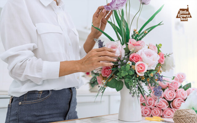 Woman arranging flowers